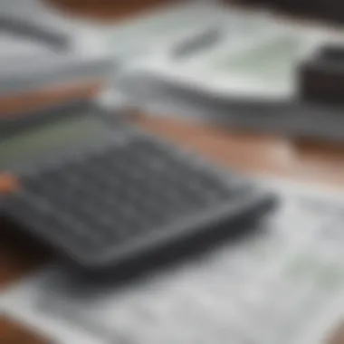 A close-up of a calculator and tax forms on a desk